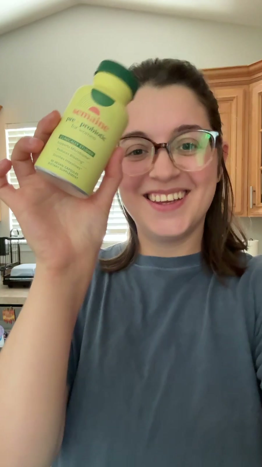 Community member holding Pre + Probiotic
