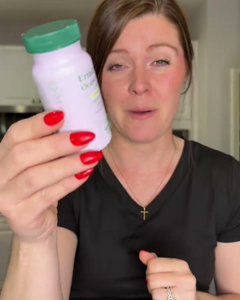Creator showing her Urinary Tract Cleanse & Protect bottle